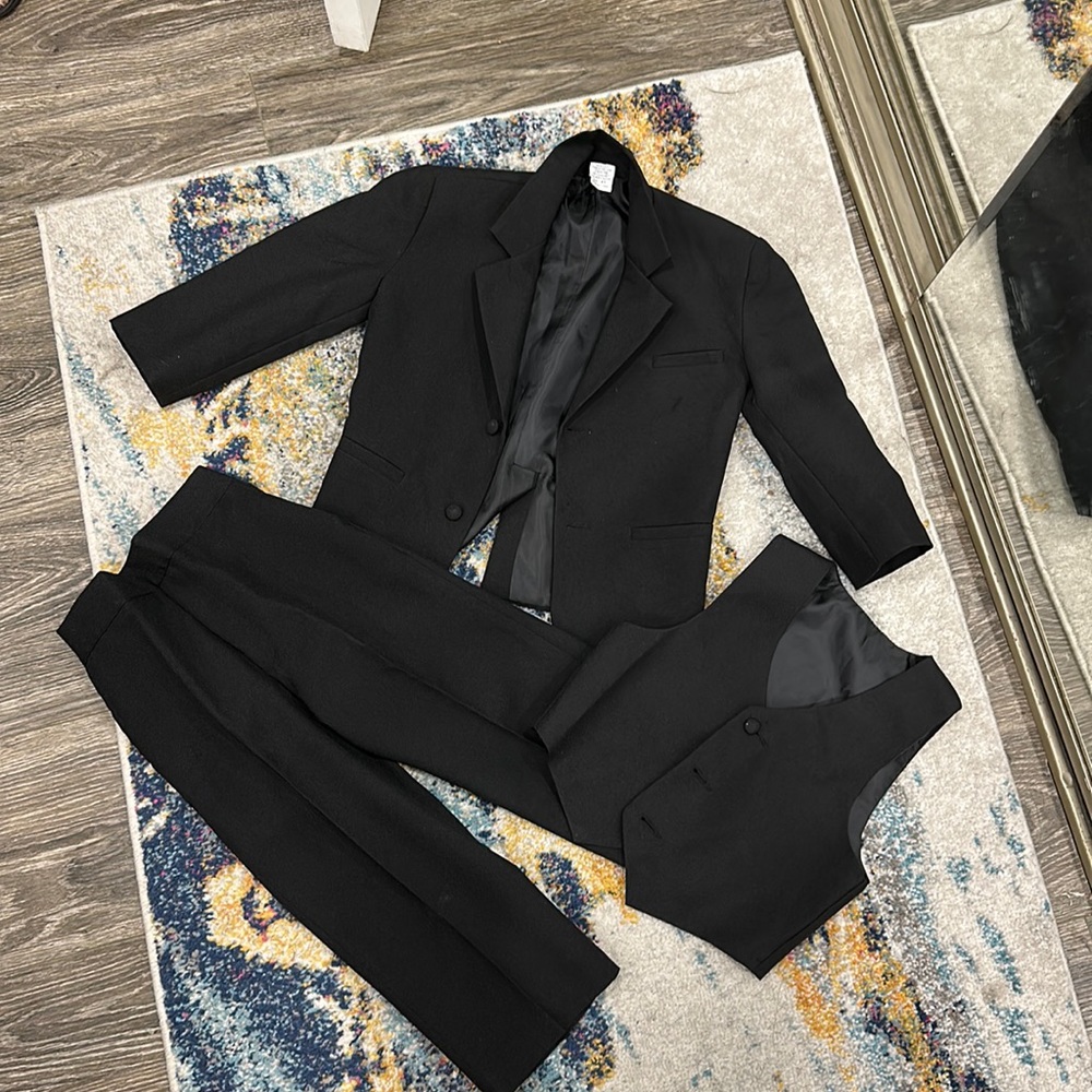 Black suit for boys. Only worn once. Excellent condition.